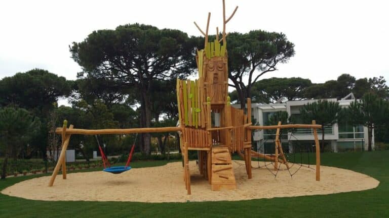 “Tree of Wisdom” - a climbing combination, birds nest swing and slide at the 2.300 sqm outdoor playground at Martinhal Cascais, Portugal